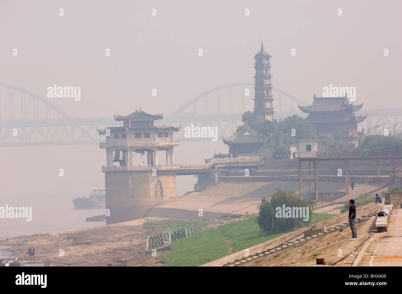 Air pollution in Jiujiang. Jiangxi procince, China. Suojiang Tower and Yangtze River Bridge in the distance. Stock Photo