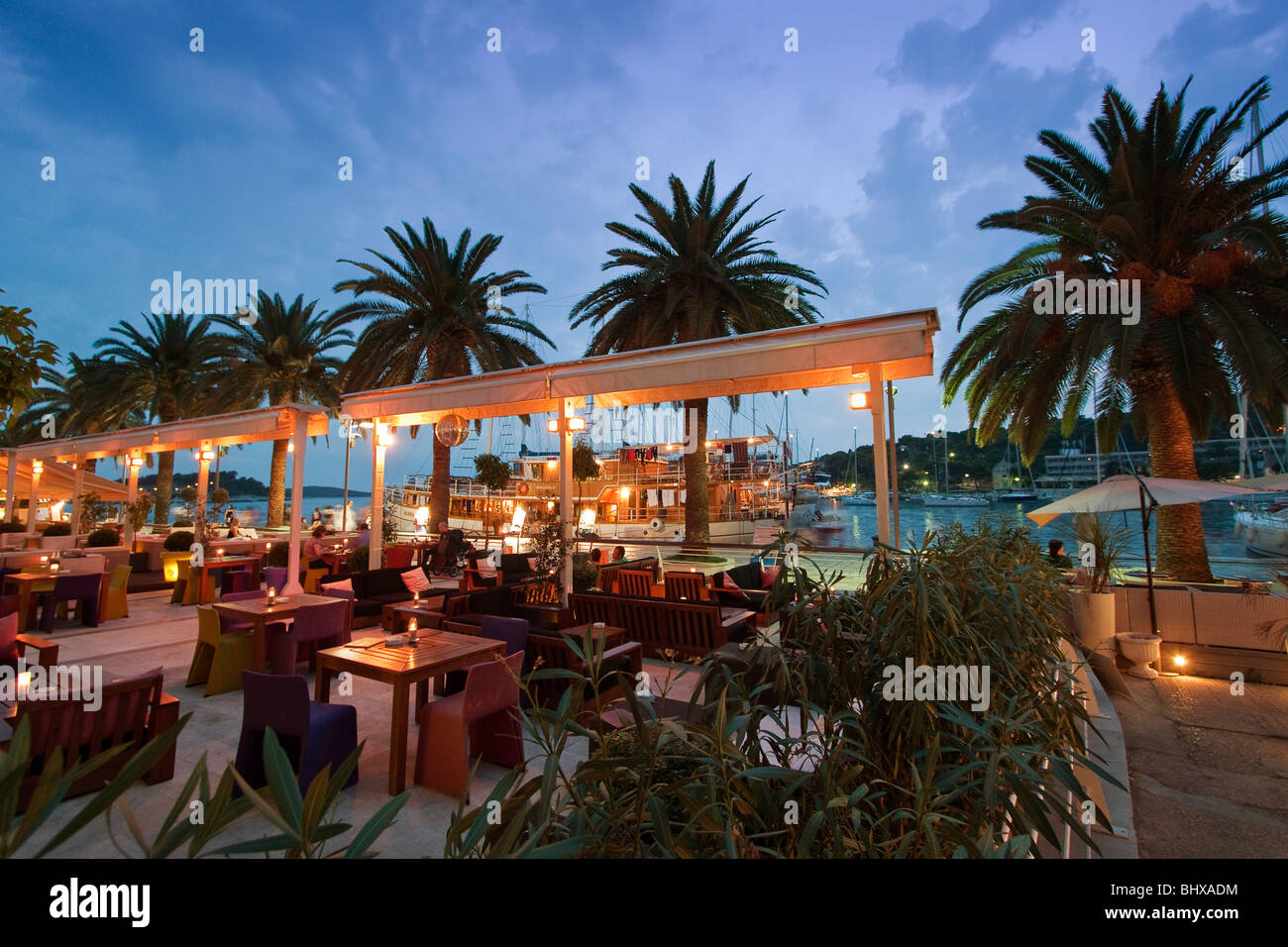 Restaurant and Bar at the Promenade of Hvar at dusk, Croatia Stock Photo