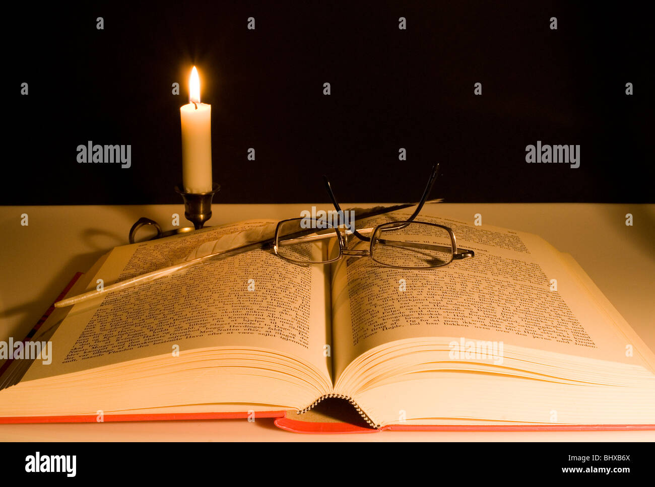 Studying late at night with a candle as light Stock Photo Alamy