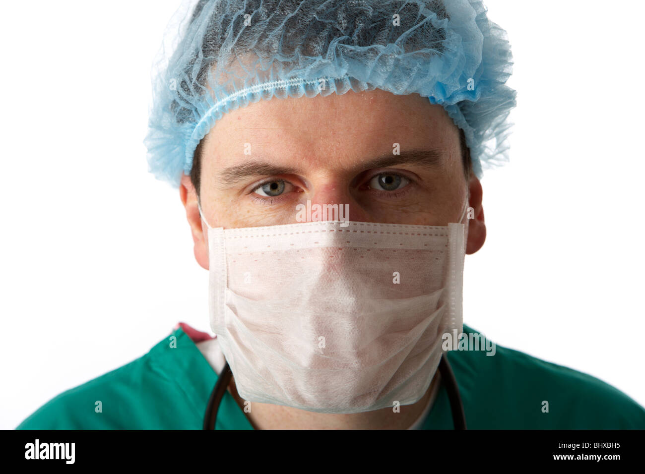 man wearing medical scrubs and stethoscope wearing face mask and hair net Stock Photo