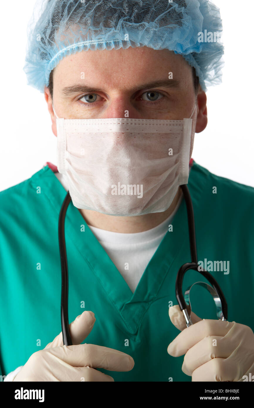 man wearing medical scrubs and stethoscope wearing face mask and hair net Stock Photo