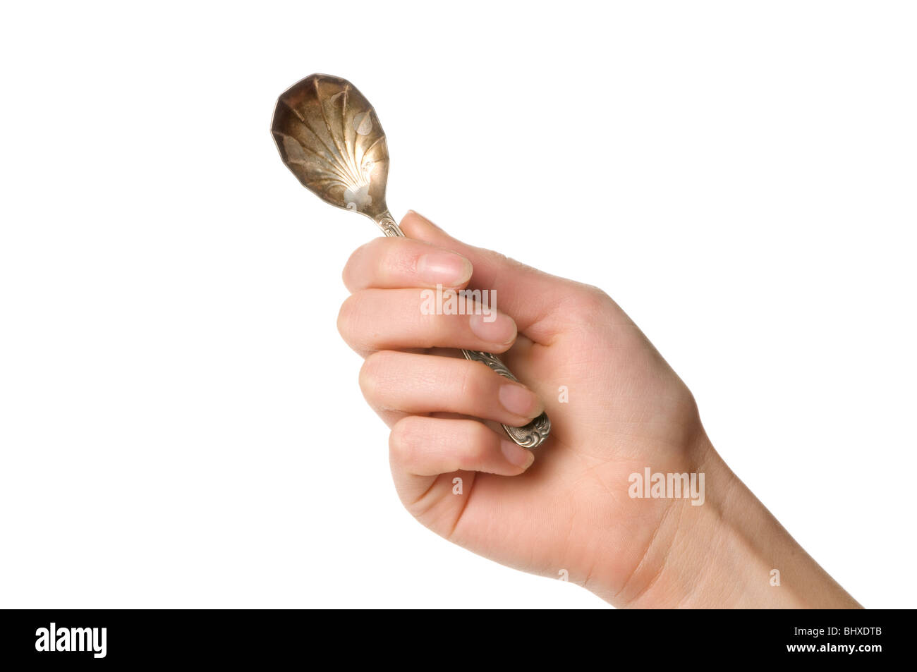 hand holding spoon Stock Photo