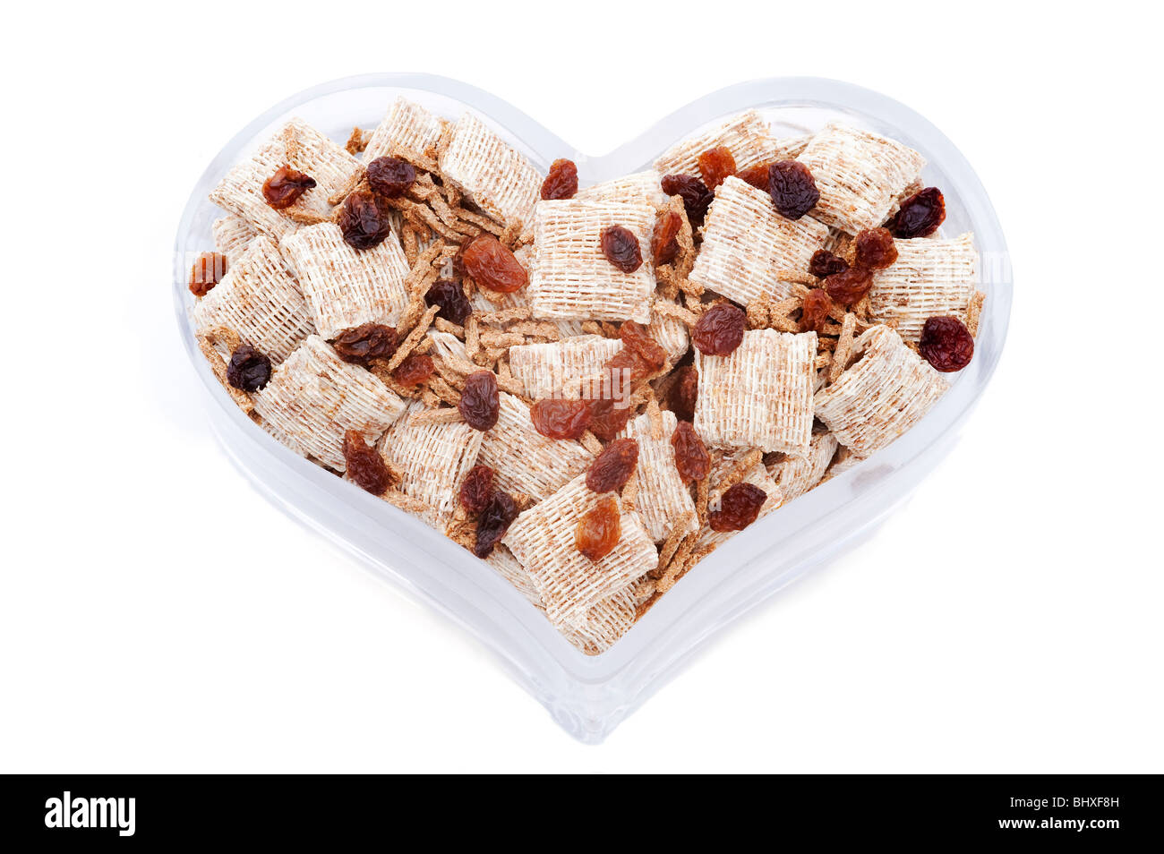 Heart shaped bowl with healthy cereals Stock Photo