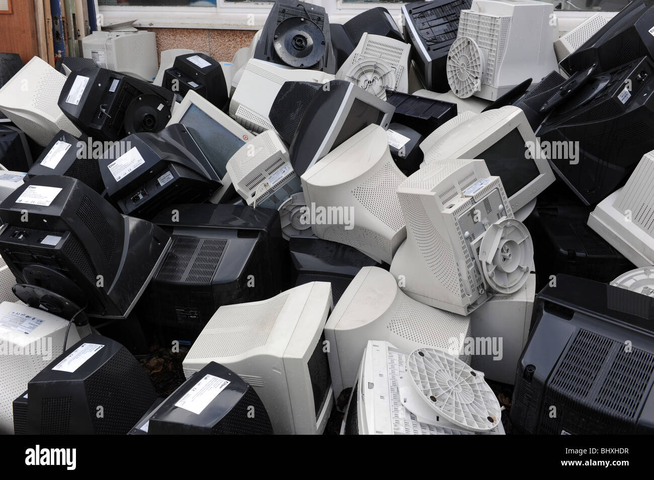 Scrap heap of unwanted computers outside a school Uk Stock Photo