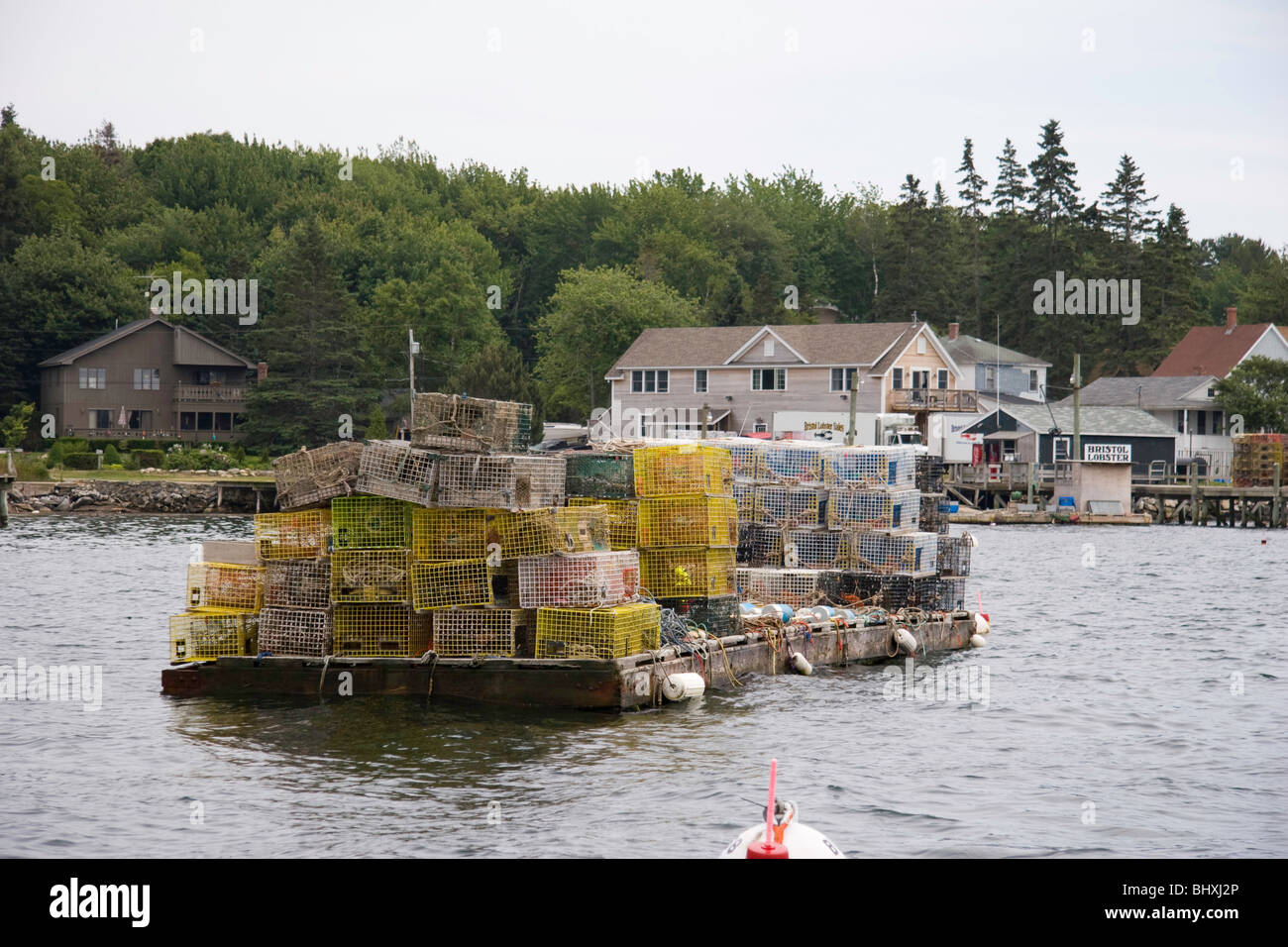 Lobster traps at the ready on a float in Maine Stock Photo Alamy
