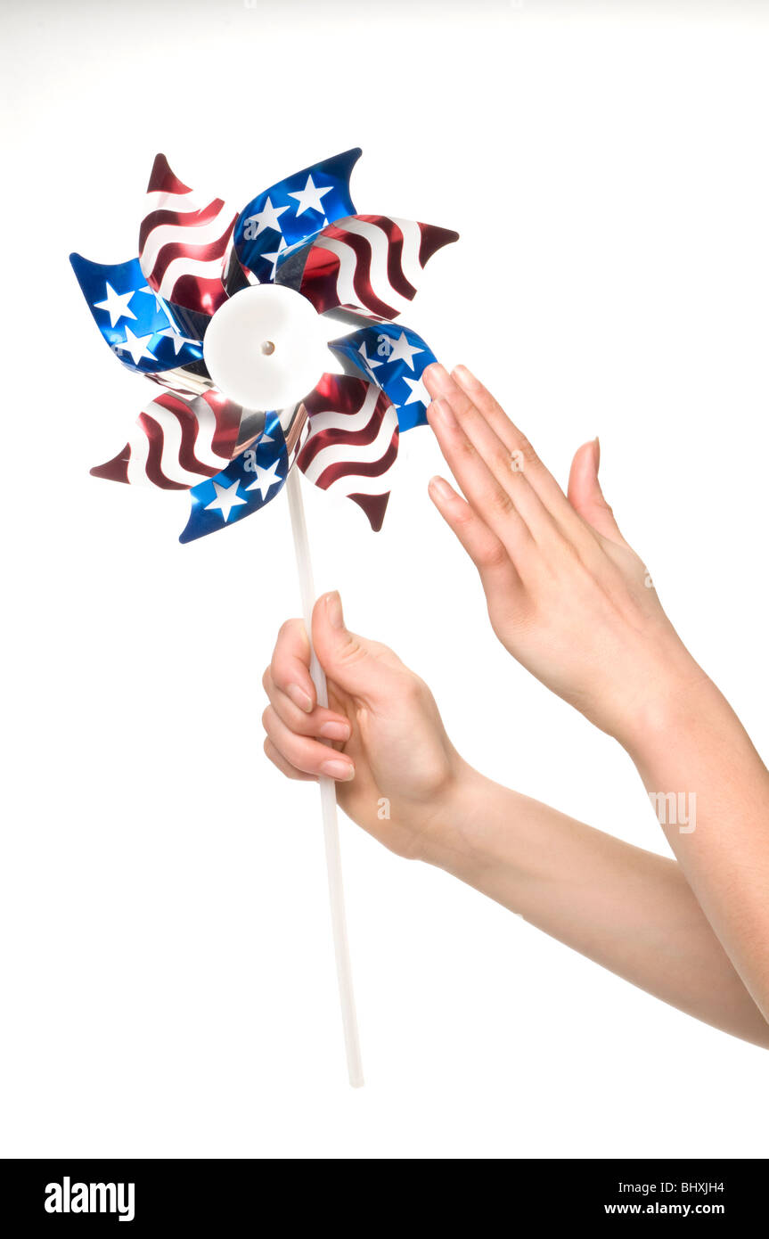 hand and pin wheel Stock Photo Alamy