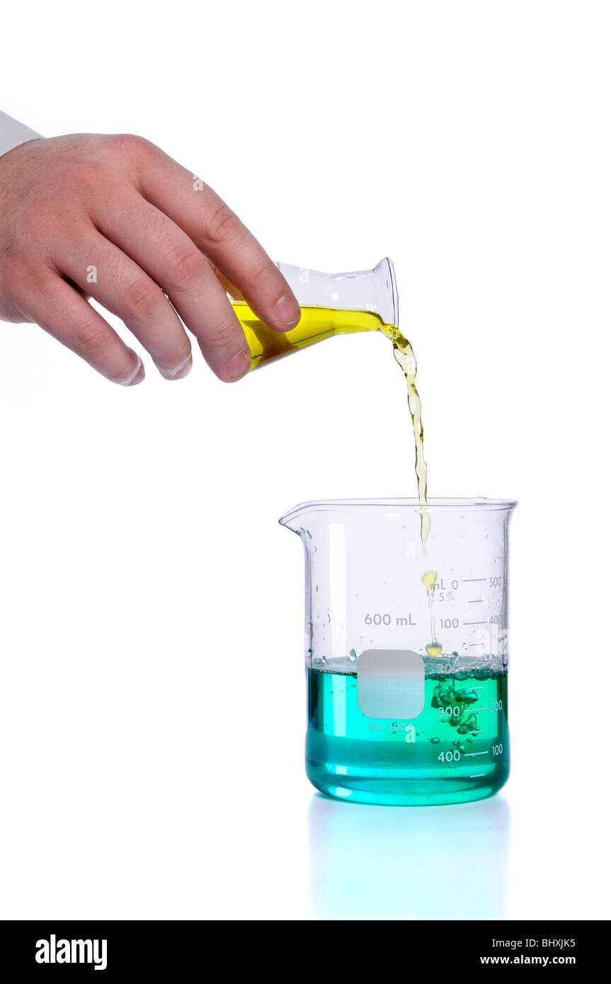 Hand pouring liquid into flak over white background Stock Photo Alamy