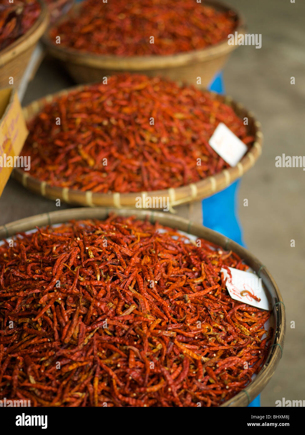 Trays of dried chilies in a market in Thailand Stock Photo Alamy