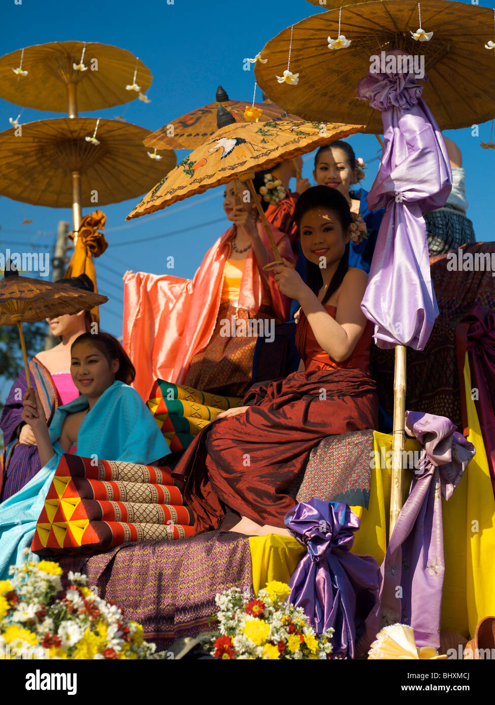 Parade float with thai ladies at the Ban Chiang annual party Stock Photo