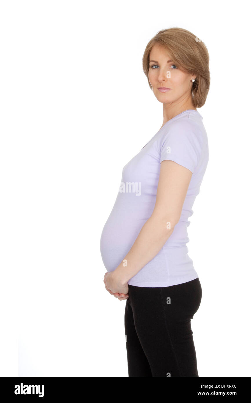 Caucasian woman who is 9 months pregnant on white background Stock Photo