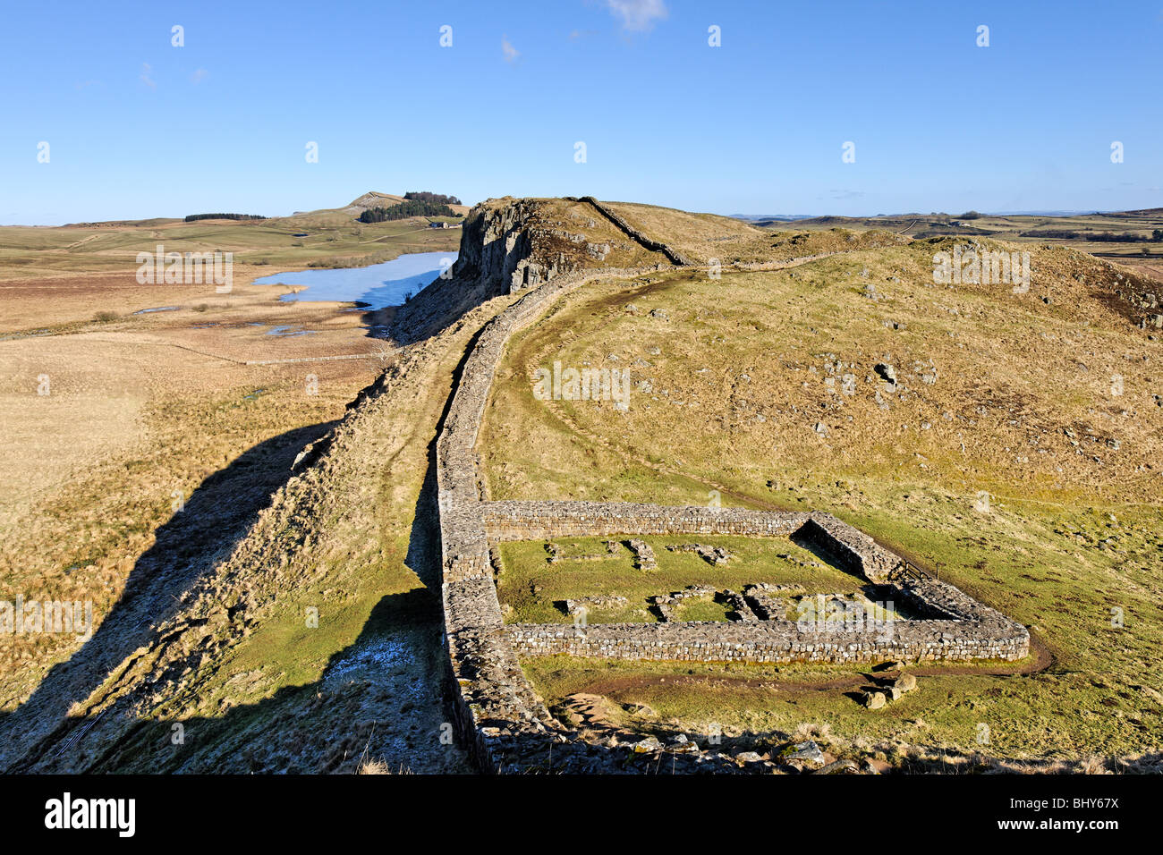 On the line of Hadrian's Wall above Milecastle 39 looking towards Highshield Crags and Crag Lough. Stock Photo