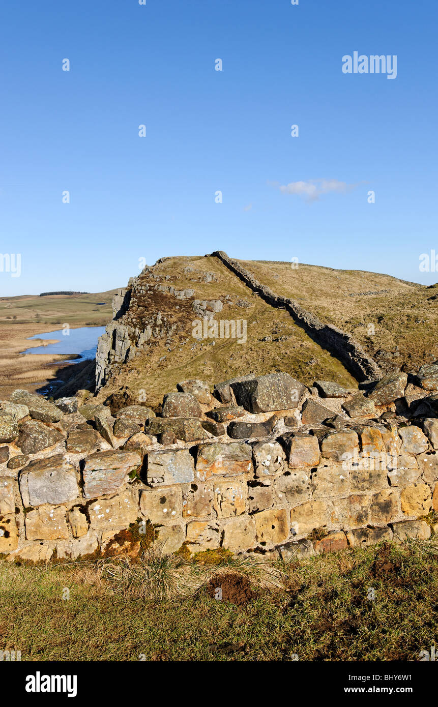On the line of Hadrian's Wall looking towards Highshield Crags and Crag Lough. Stock Photo