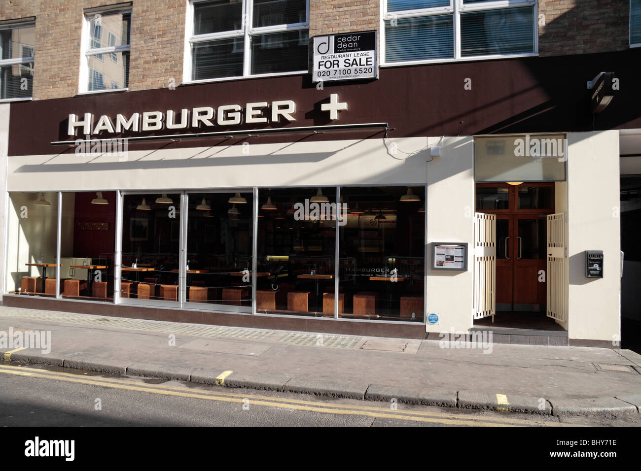 The shop front of Hamburger plus restaurant on Dean Street, London, UK. Stock Photo