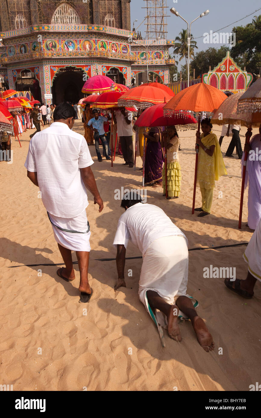 India, Kerala, Alappuzha, (Alleppey) Arthunkal, feast of St. Sebastian, pilgrim crawling from beach ritual on hands and knees Stock Photo