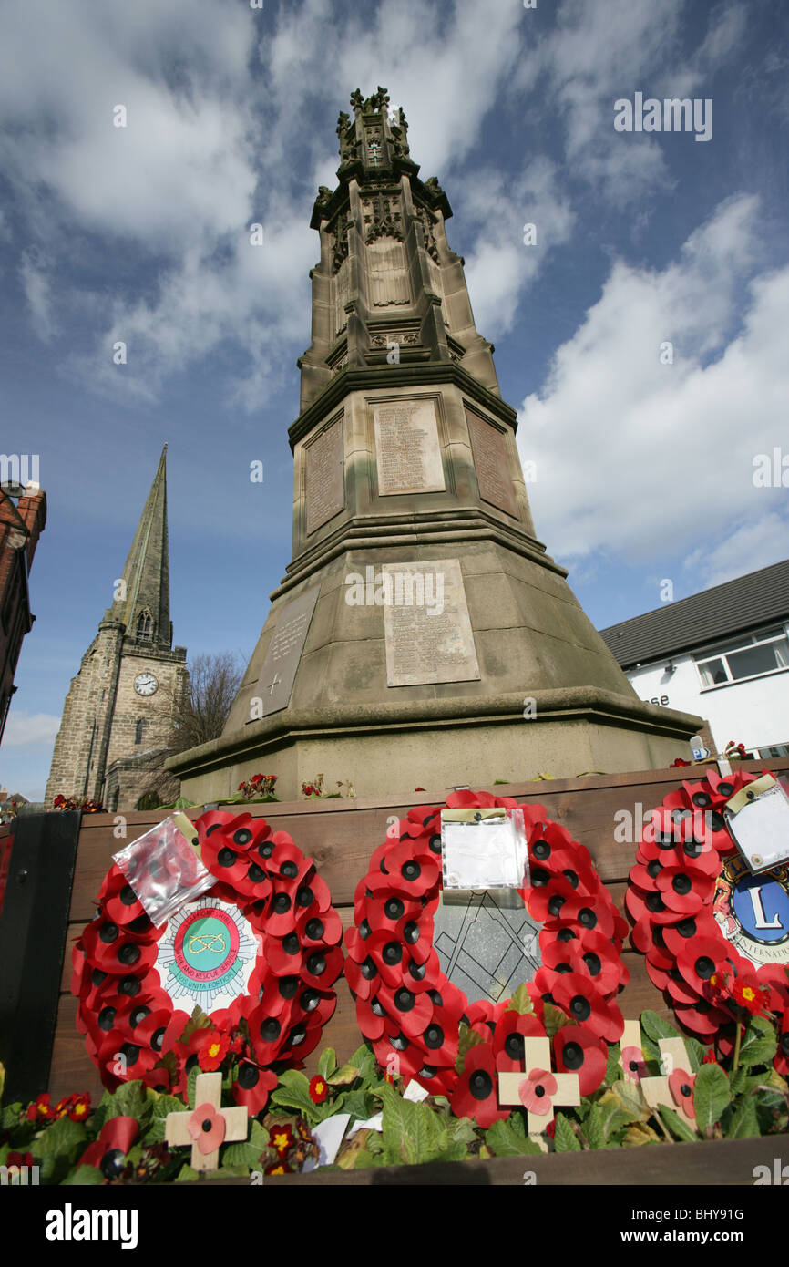 Town of Uttoxeter, England. Town War Memorial at Market Square, with the spire of St Mary the Virgin church in the background. Stock Photo