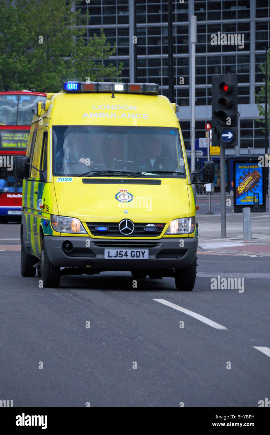 London ambulance with blue lights flashing on an emergency call Euston