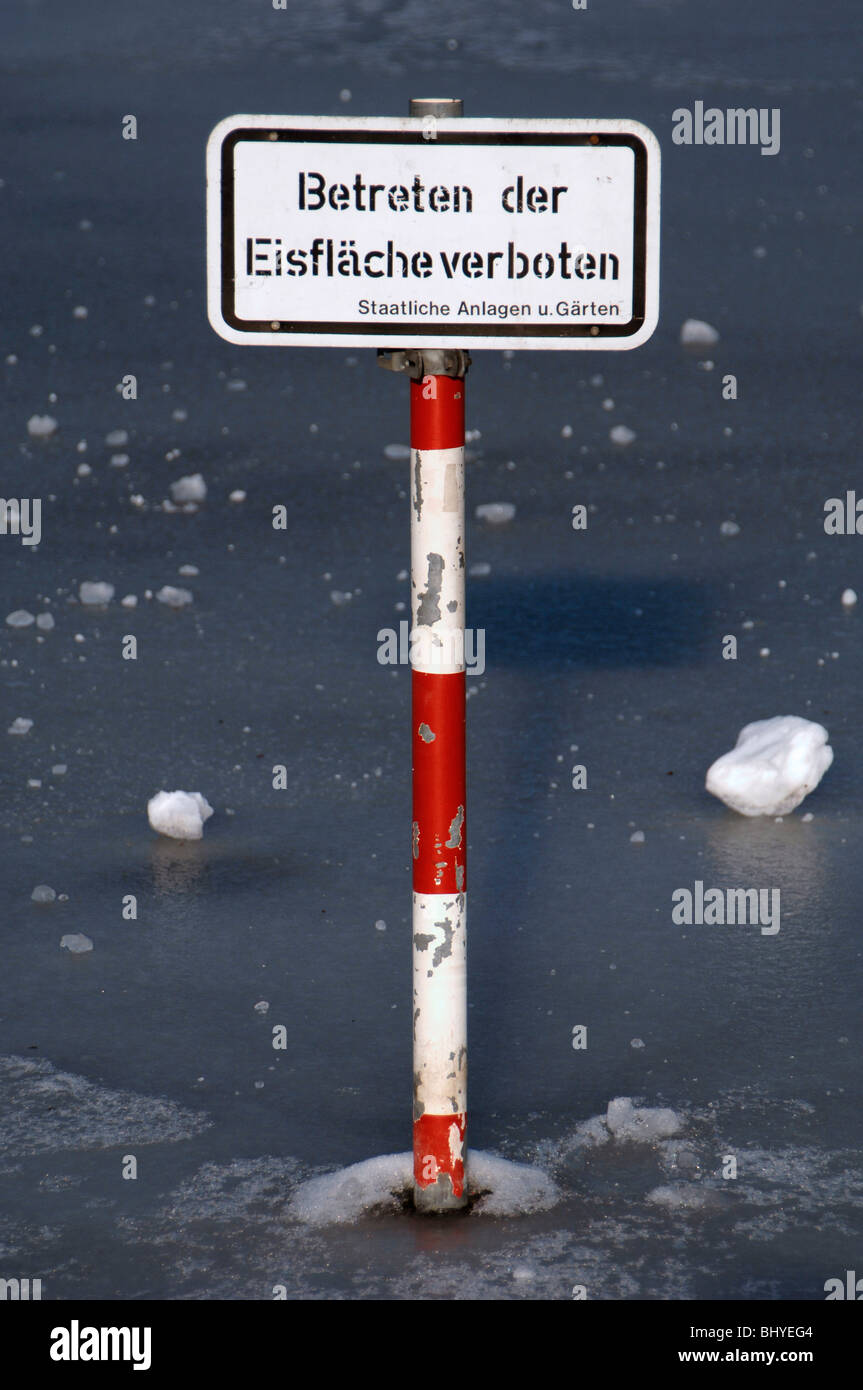 warning sign frozen lake Stuttgart Germany Stock Photo