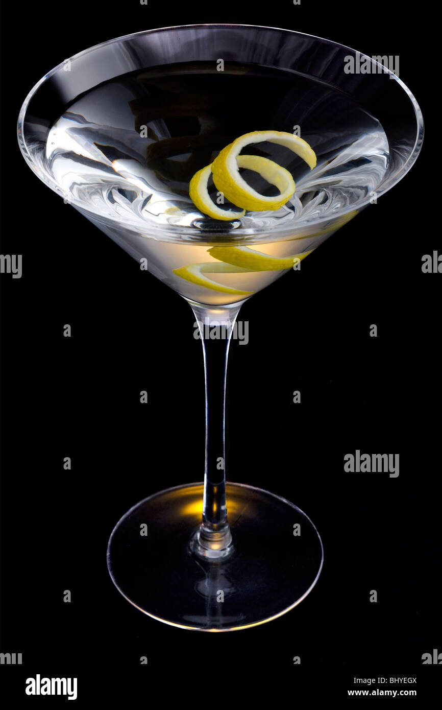Straight up Martini with Lemon Twist Garnish on Black Background Stock