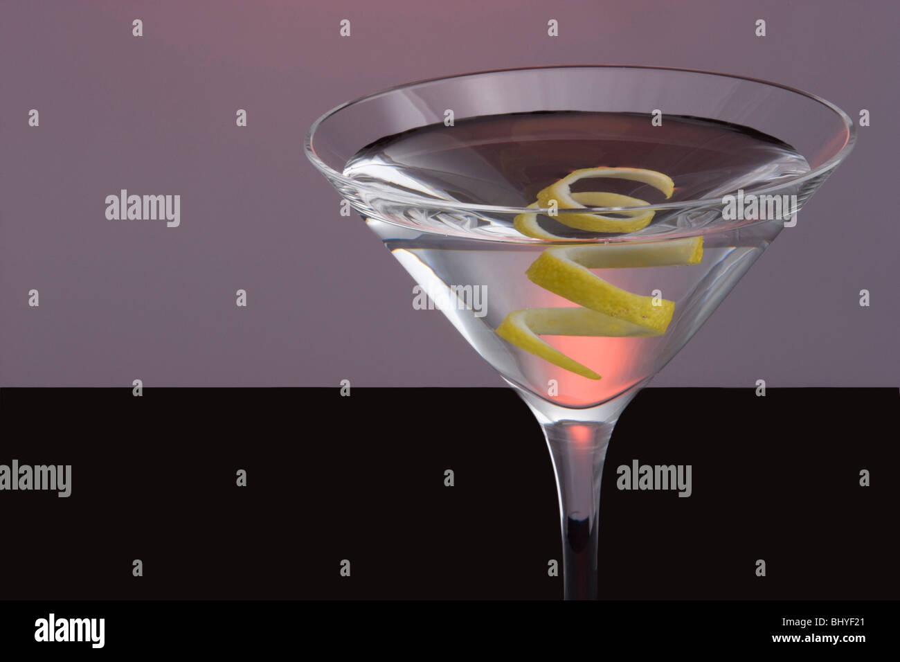 Straight up Martini with Lemon Twist Garnish on Black and Grey