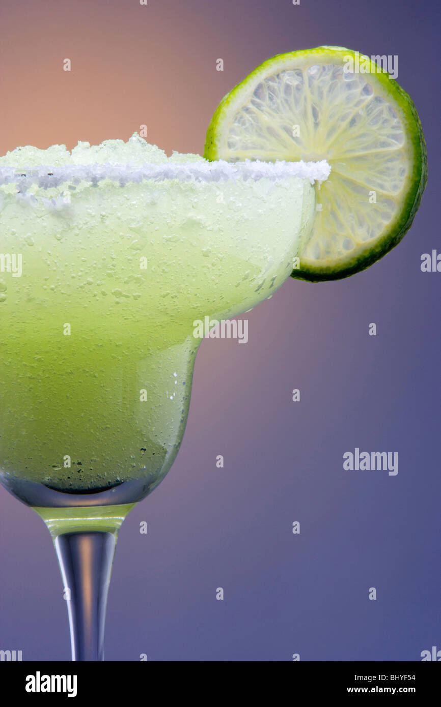 Frozen Margarita with Lime Garnish on Highlighted Background Stock
