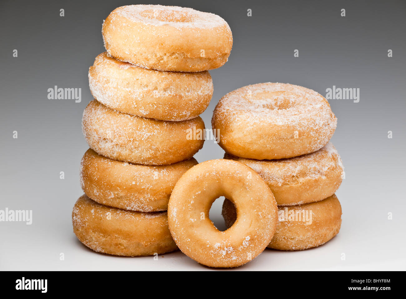 Stack of 9 sugary doughnuts Stock Photo