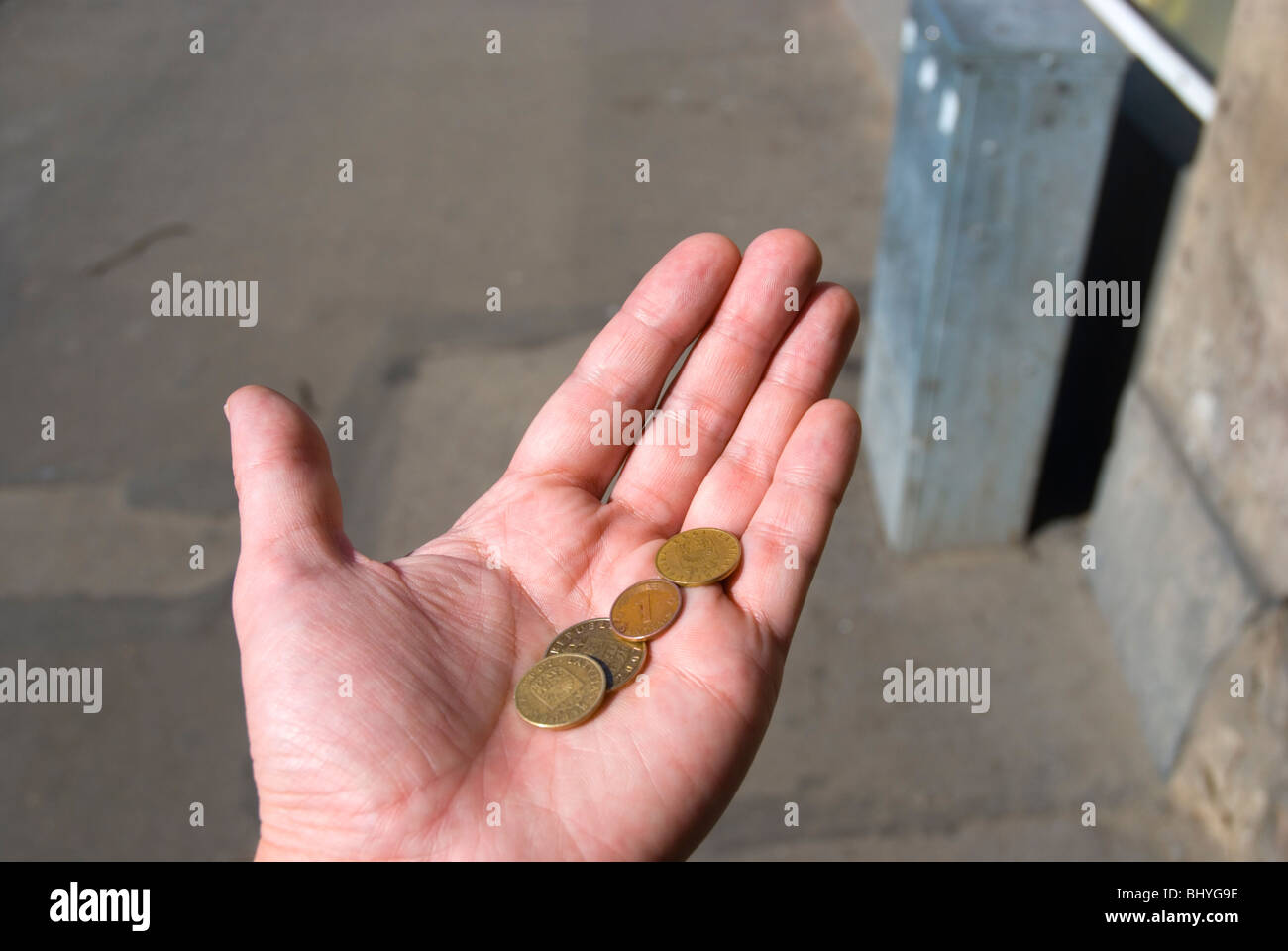 Person with very little money as Latvians Lats in Riga Latvia Europe Stock Photo