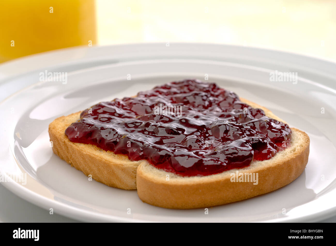 Morning breakfast with orange juice and jam or jelly on toast Stock Photo