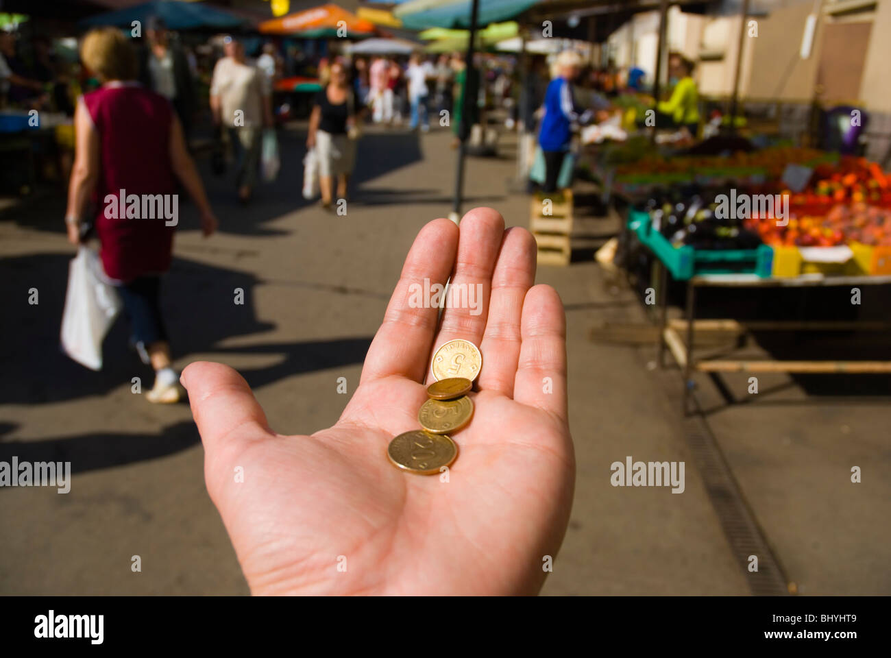 Person with very little money as Latvians Lats in Riga Latvia Europe Stock Photo