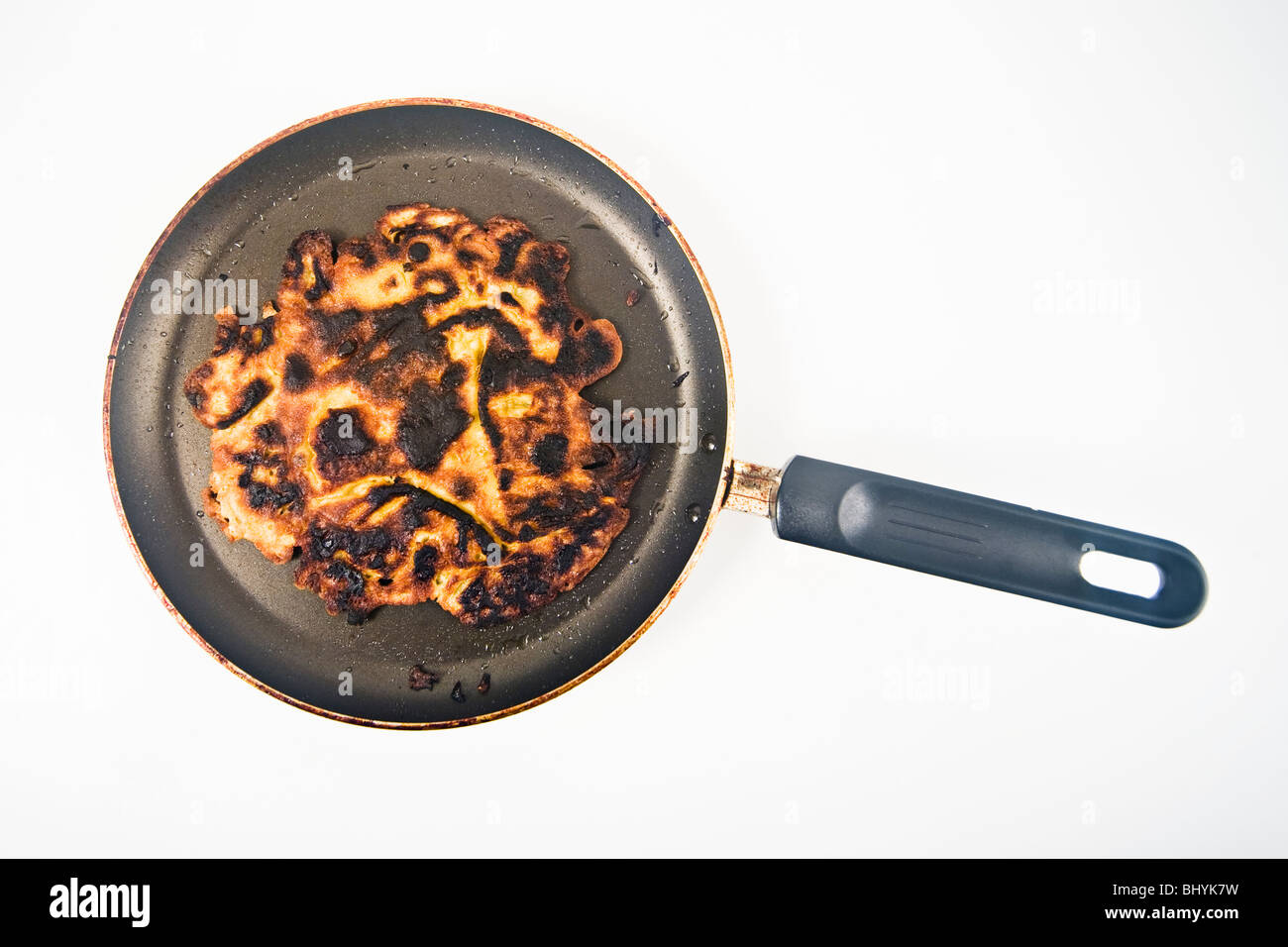 burned pancake in a pan Stock Photo Alamy
