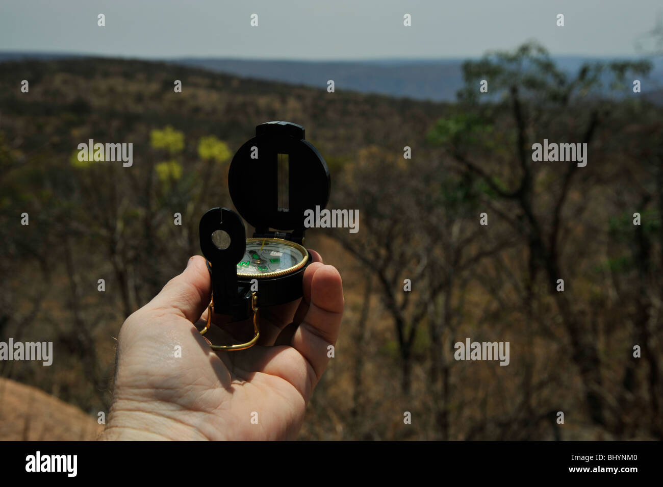 Limpopo, South Africa, hand holding compass, navigation bearing, hiking