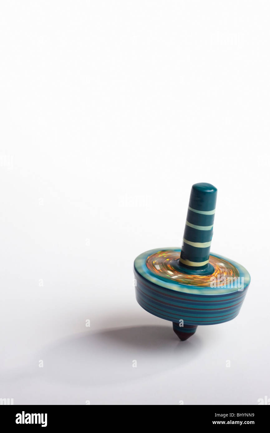 Colourful, spinning top. Isolated. Copy space Stock Photo Alamy
