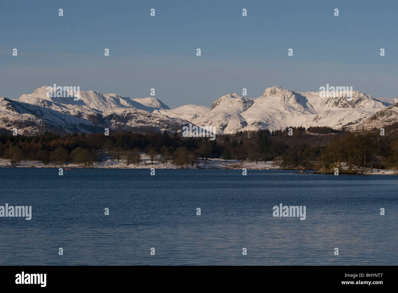 Bowfell & the Langdale Pikes from Lake Windermere in the snow of Jan 2010. Stock Photo