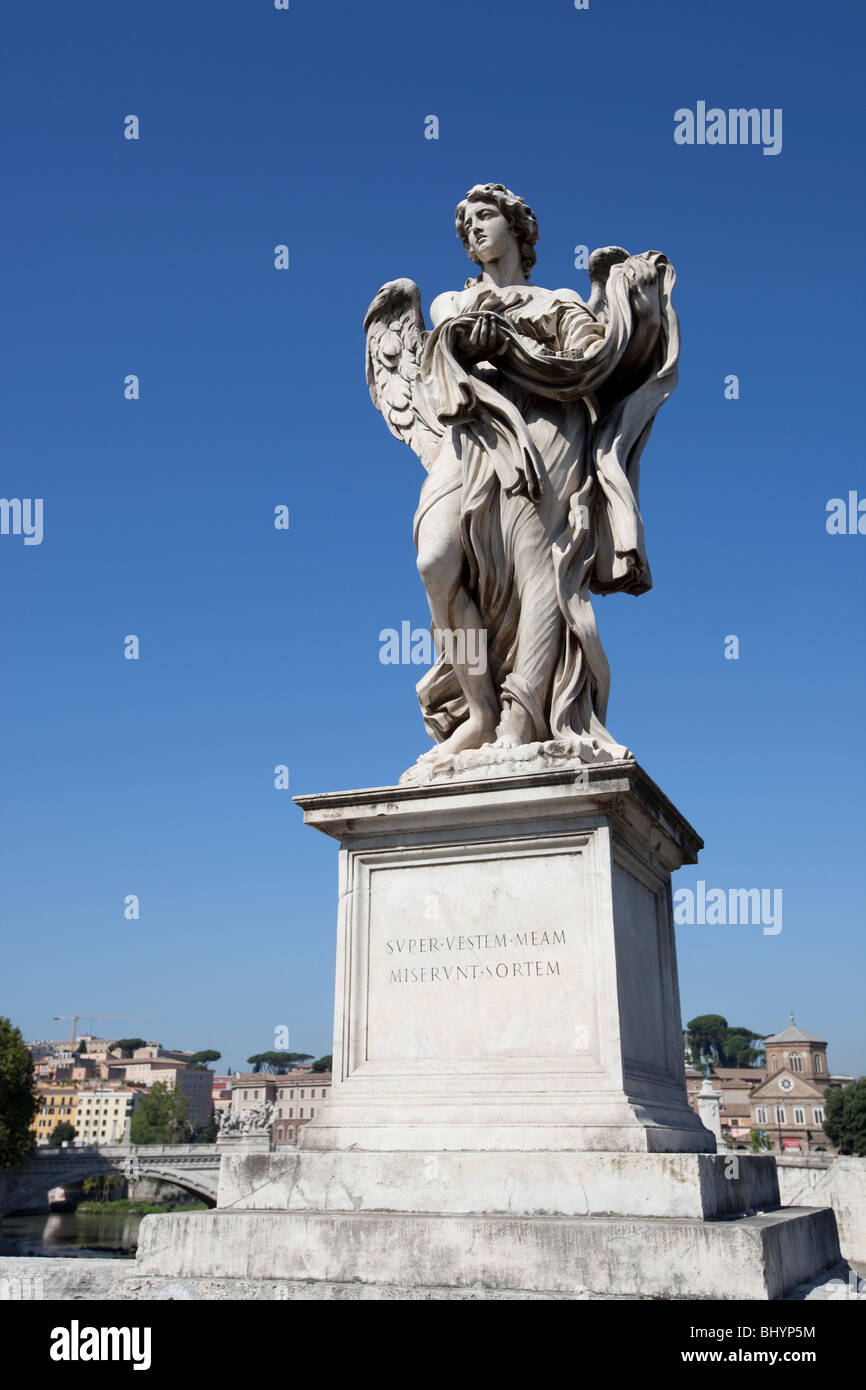 Angel figure with robe and dice Stock Photo