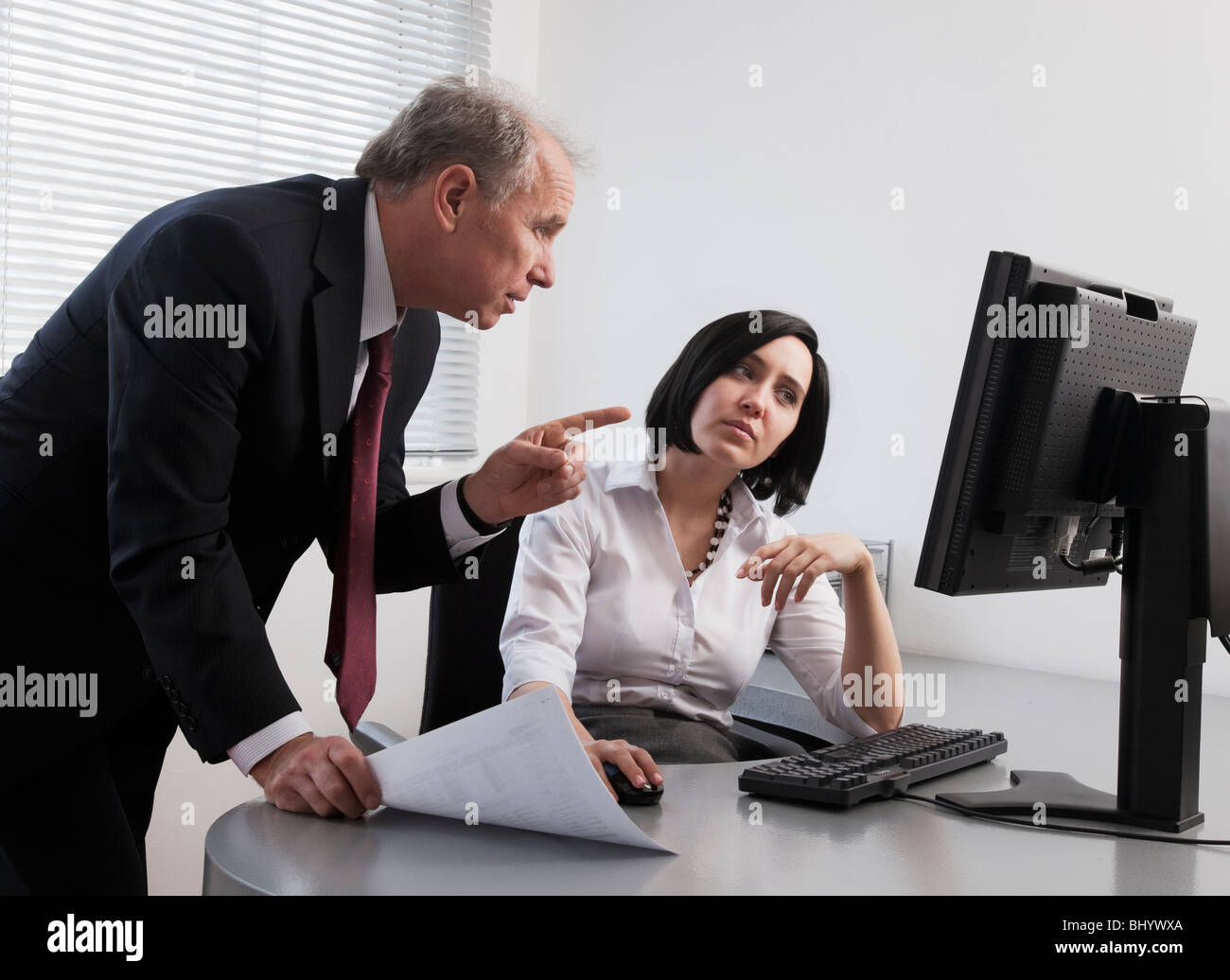 Male and female colleagues collaborating on a project Stock Photo