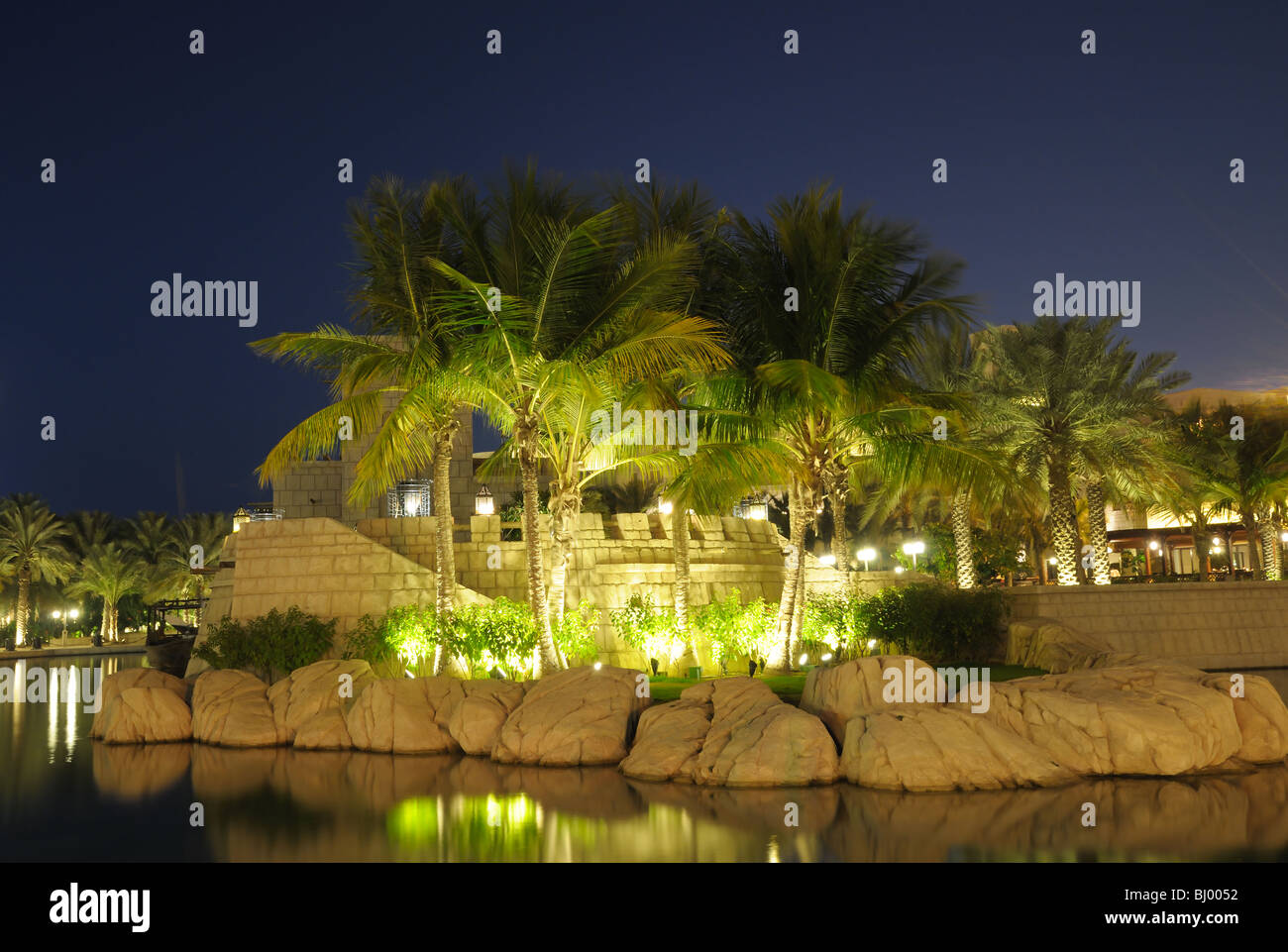 Illuminated Palm Trees in Madinat Jumeirah Resort, Dubai, United Arab Emirates Stock Photo