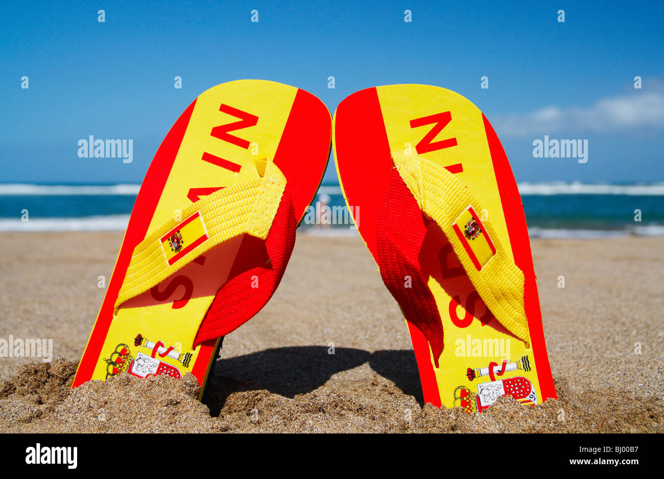 Flip flops in colours of Spanish flag with Spain written embossed on them  Stock Photo - Alamy