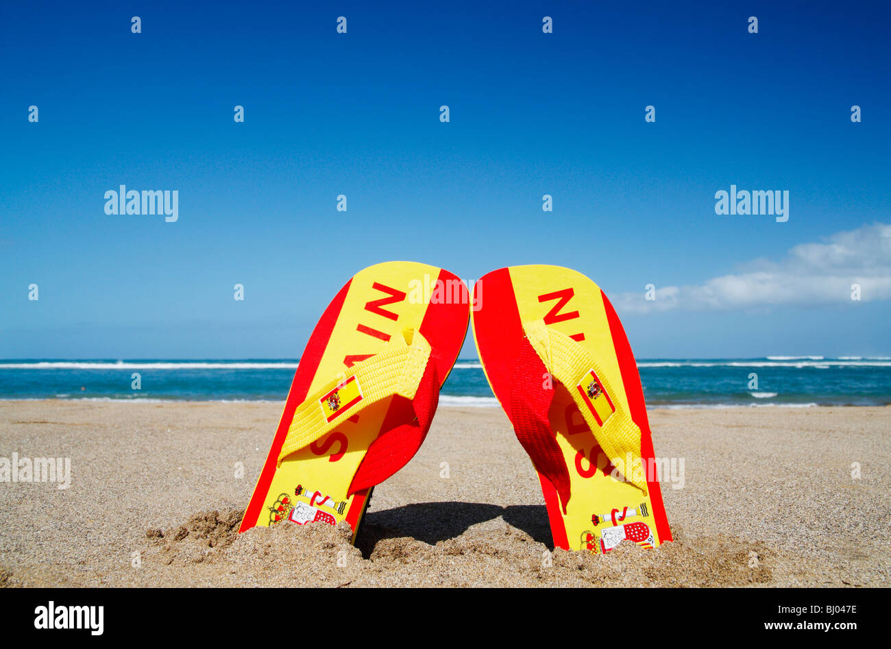 Flip flops in colours of Spanish flag with Spain written on them Stock
