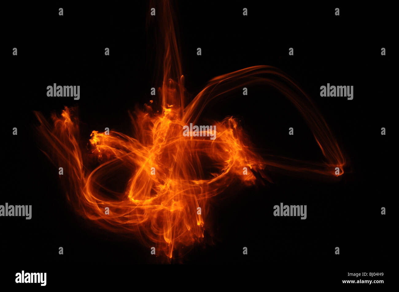 flames dancing among the darkness Stock Photo - Alamy