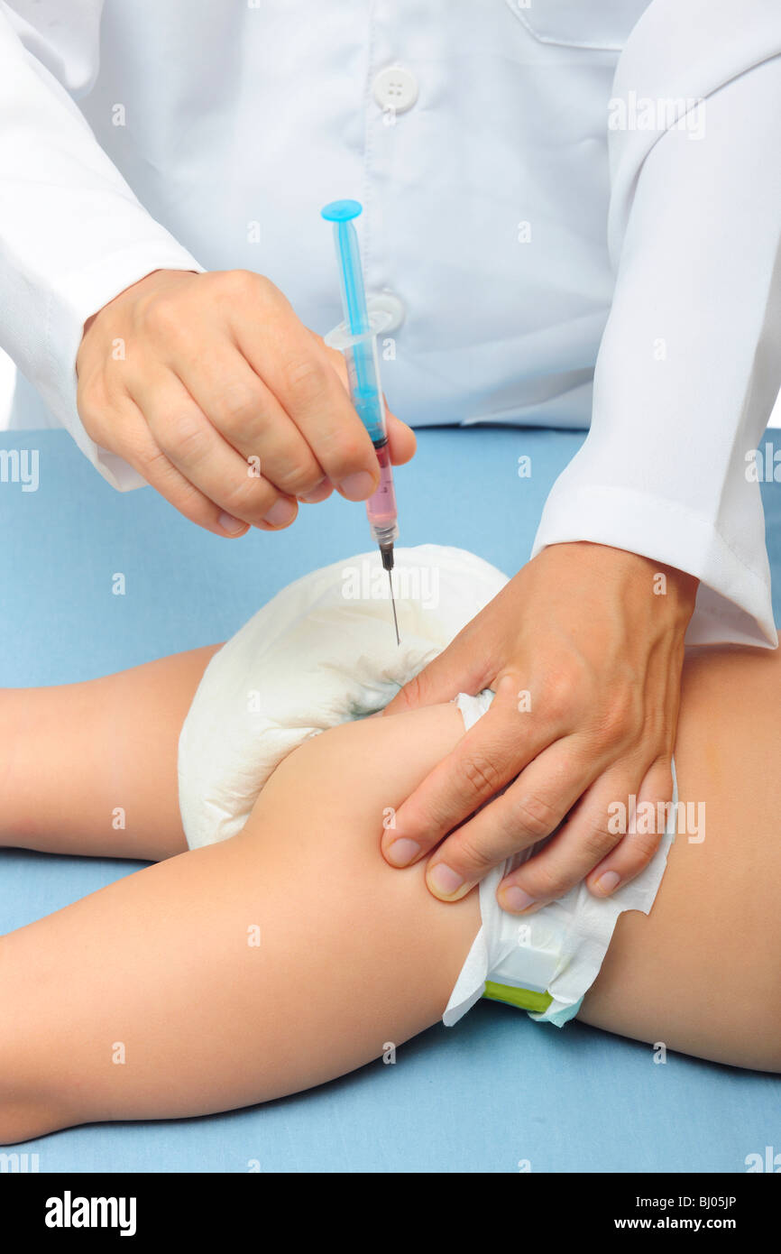 Vaccination: doctor injecting baby Stock Photo