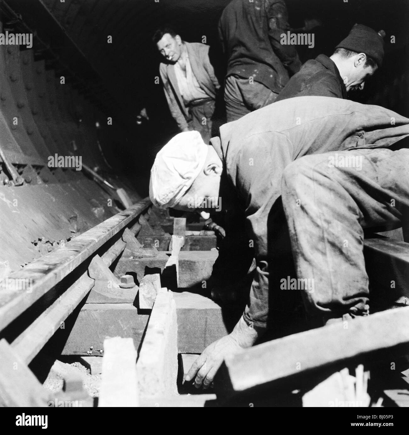 Repairing underground train tracks, London, 1955. Artist: Henry Grant Stock Photo