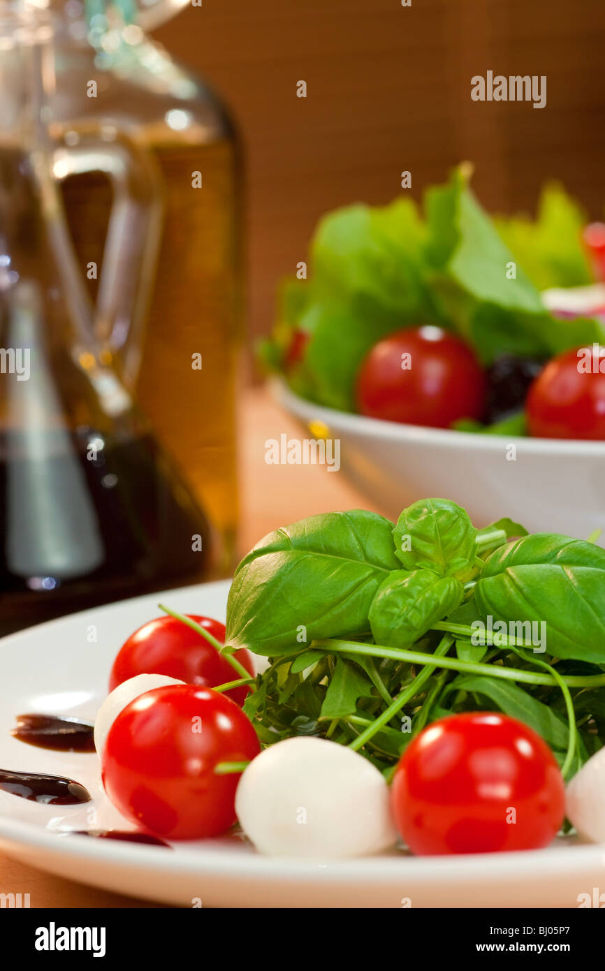 Tomato, mozzarella, rocket salad with olive oil and balsamic vinegar