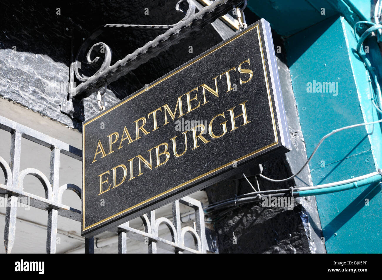 Sign for rental apartments on the Royal Mile, Edinburgh, Scotland, UK