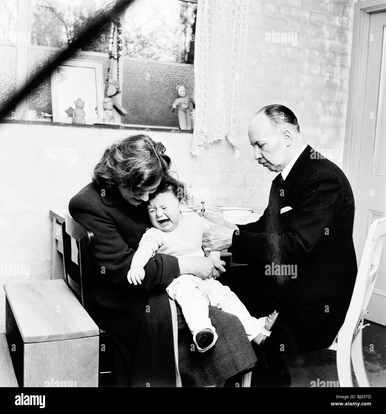 Baby being immunised, London, 1953. Artist: Henry Grant Stock Photo