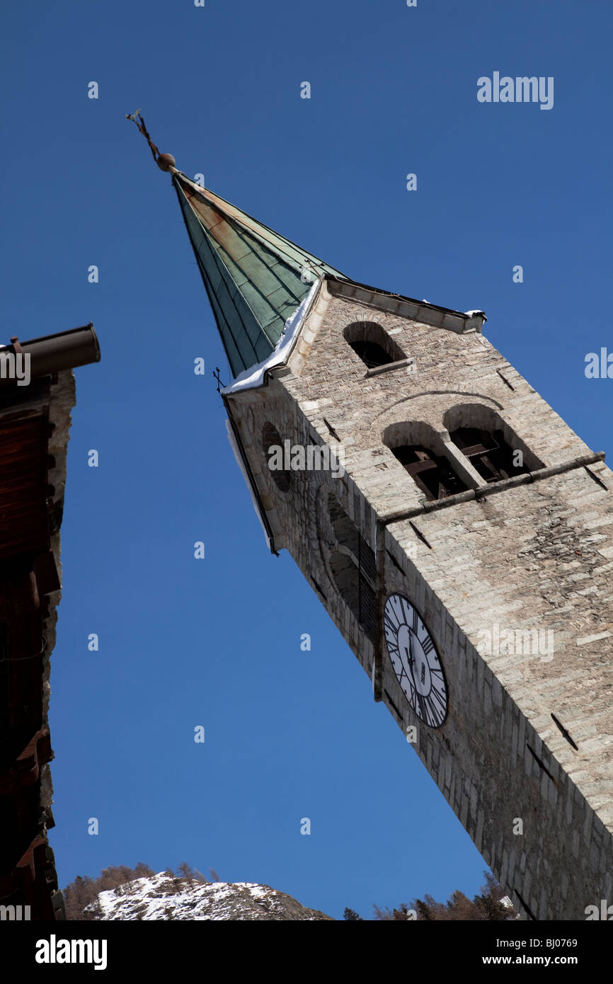 Clock and bell tower in alpine Walser village, Gressoney, Monte Rosa, Italy Stock Photo