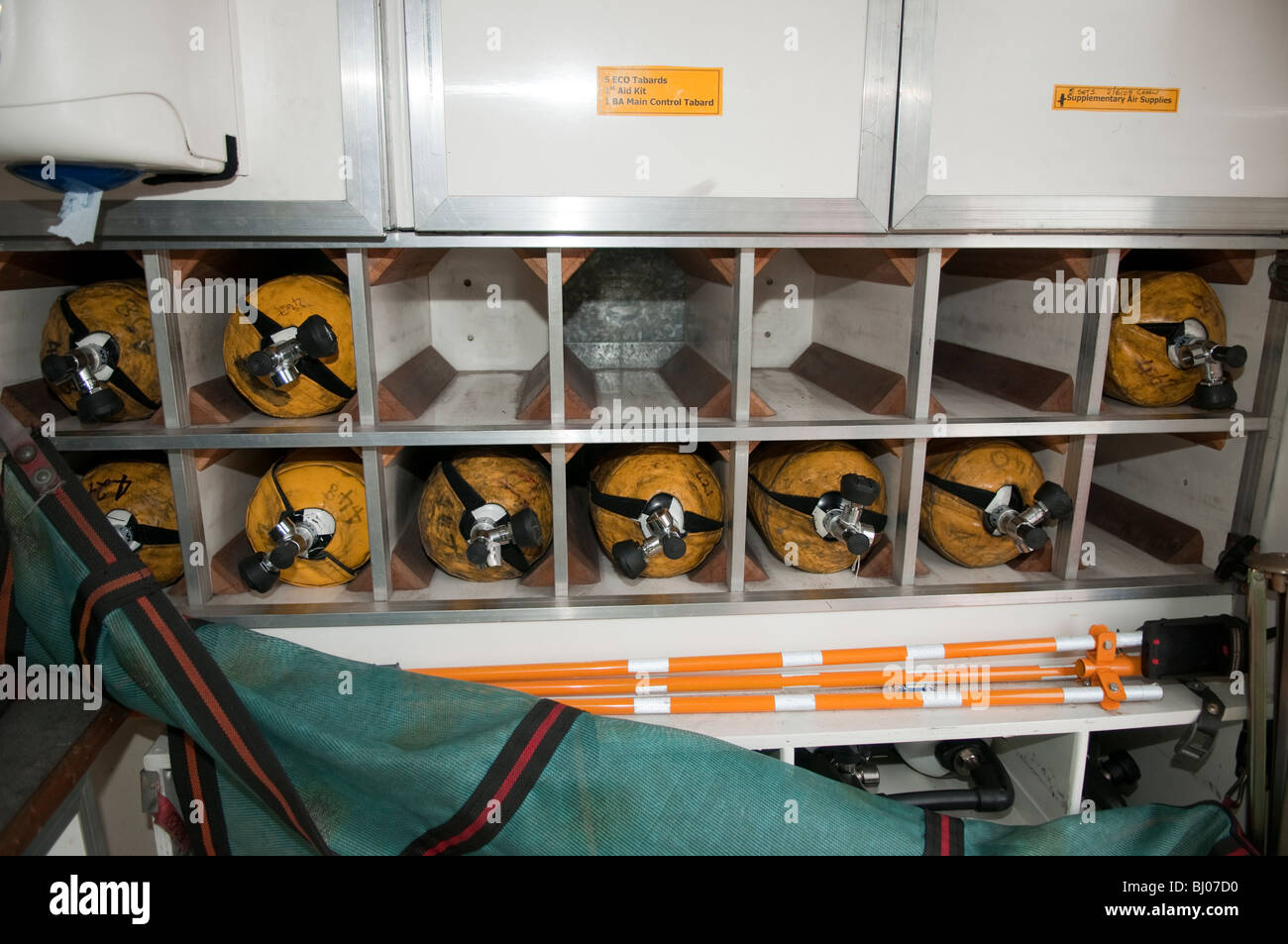 Firemans breathing apparatus cylinders in rack Stock Photo Alamy