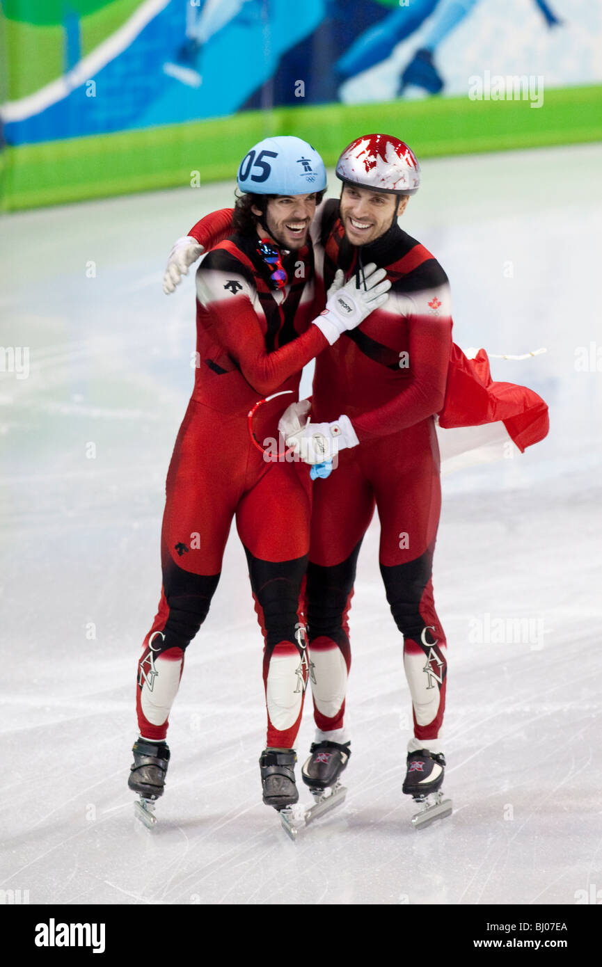 Charles Hamelin (CAN) and Francois-Louis Tremblay (CAN) after winning the gold and bronze medals in the Short Track 500m semi Stock Photo