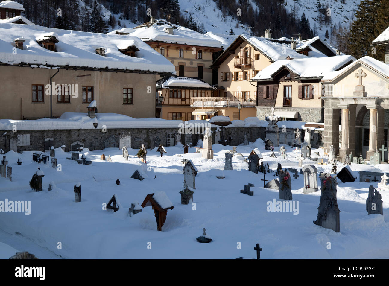 Walser village in Gressoney la Trinité with cemetery in the front . Valle d'Aosta Italy Stock Photo