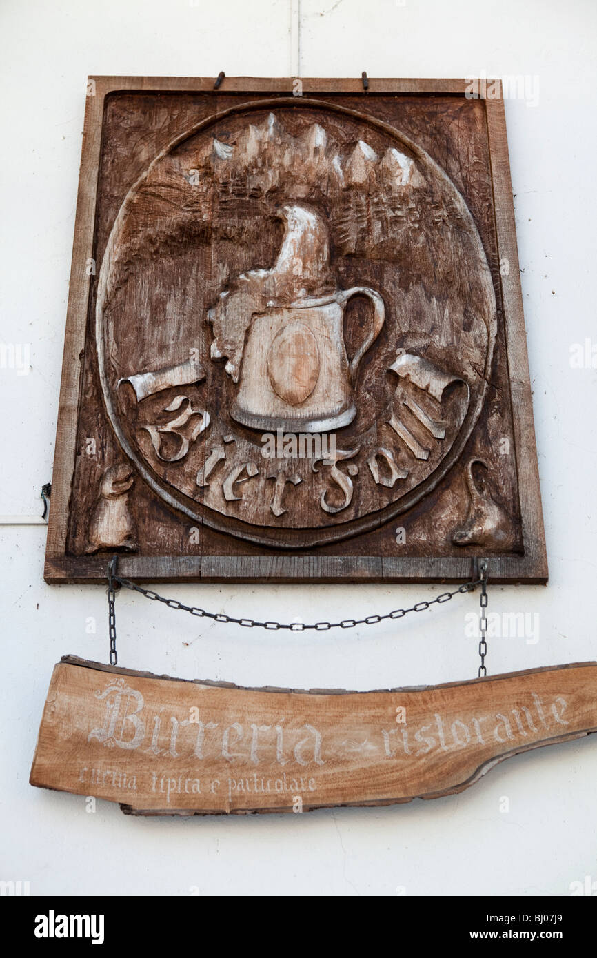 Handmade pub sign for beer and restaurant pub in Gressoney old Walser dorf village, Valle d'Aosta, Italy Stock Photo