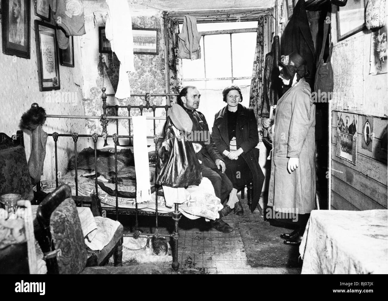 Salvation Army visiting a resident in Notting Hill, London, c1900. Artist: Unknown. Stock Photo