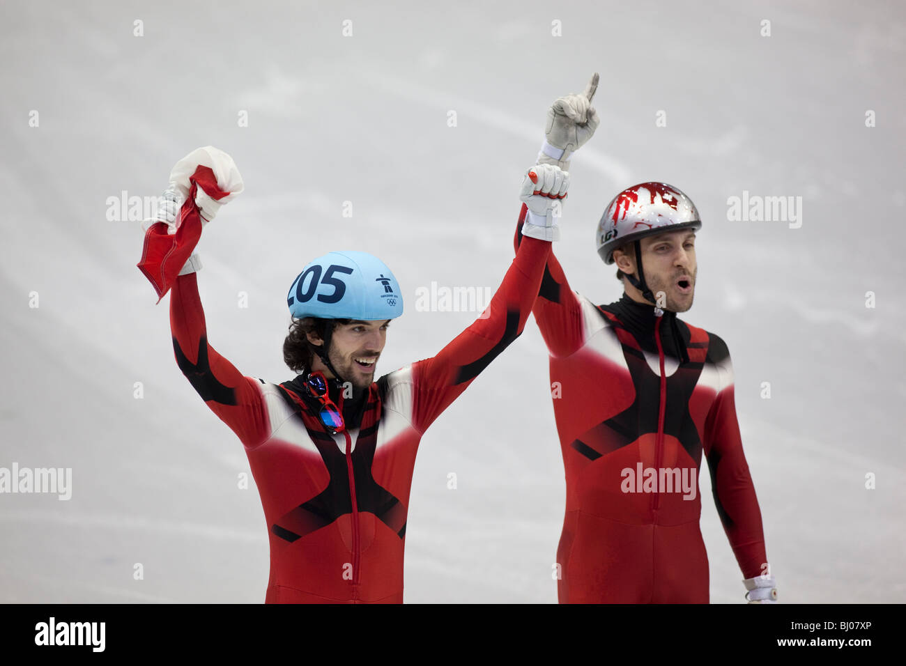 Charles Hamelin (CAN) and Francois-Louis Tremblay (CAN) after winning the gold and bronze medals in the Short Track 500m semi Stock Photo